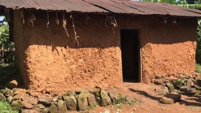 Reel: a mud-walled house in the community